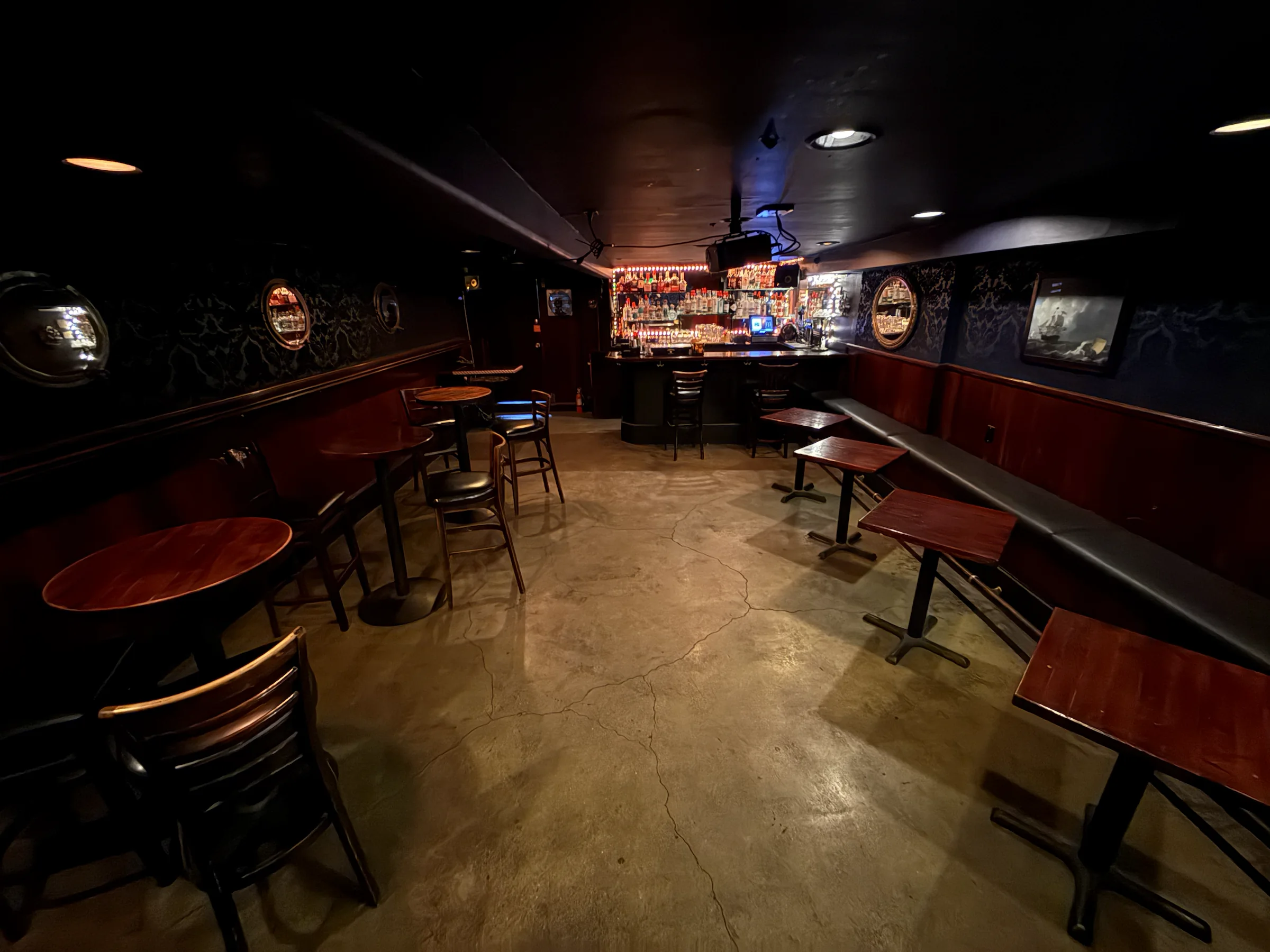 Wide view of the entire private downstairs room and bar