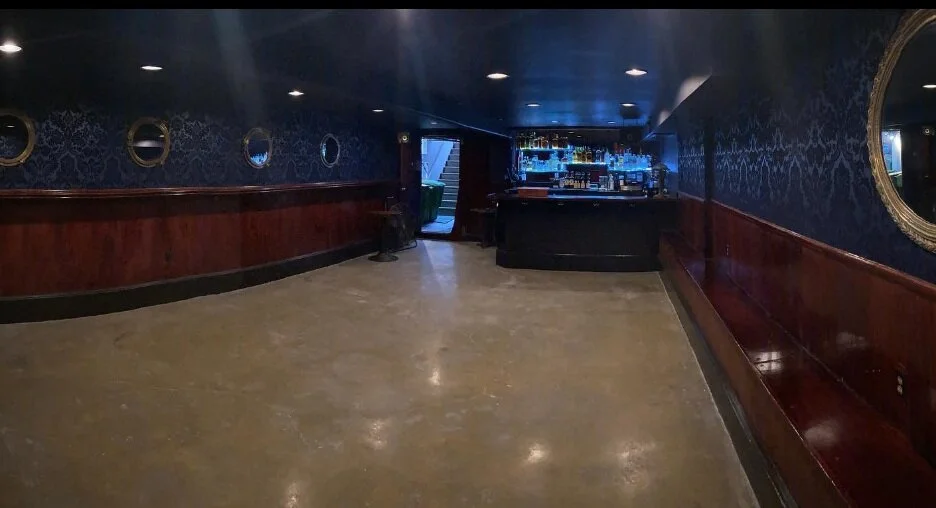 Wide view of the private downstairs bar and dance floor